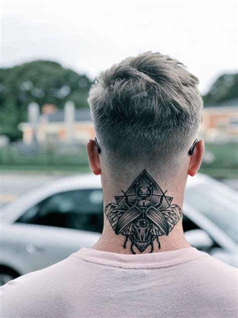 men's back of neck tattoo|More.